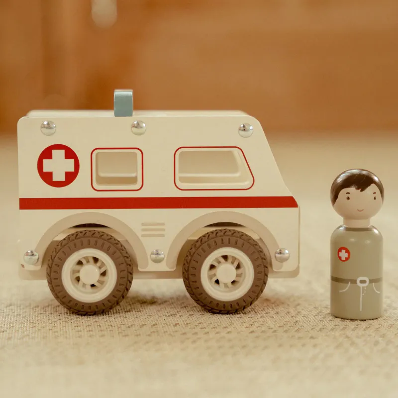 Ambulanse med trefigur