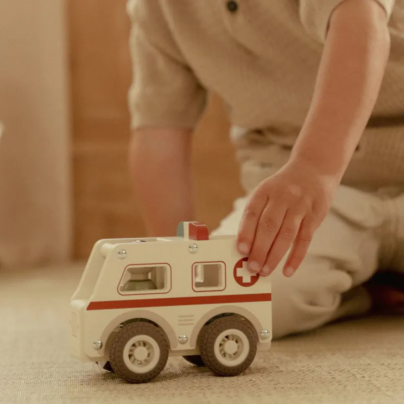 Ambulanse med trefigur